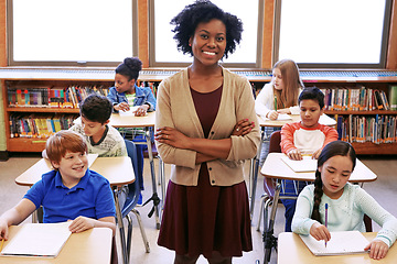 Image showing Portrait, black woman and teacher with students learning in classroom or middle school. Arms crossed, education scholarship and confident and happy female educator with children ready for studying.