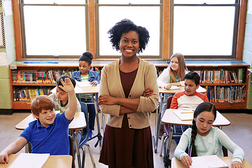 Image showing Portrait, teacher and education with a black woman in a classroom, standing arms crossed with her students. School, learning or study with a female educator in a class with a boy and girl pupils