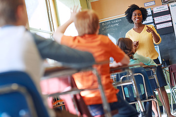 Image showing Teaching, question and children in classroom with teacher in academy lesson, learning and studying. Knowledge, education and students, school kids and learner with hand for asking, ideas and answer