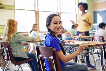 Image showing School, child portrait and education in a classroom with a lesson to study and learn knowledge. Diversity students or children in class while learning for future, development and growth with teacher