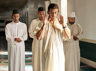 Image showing Men, mosque and muslim prayer to Allah for religion, ramadan kareem and worship of arabic culture. Group of people praying with islamic imam to God with holy dua, spiritual focus and peace in Qatar