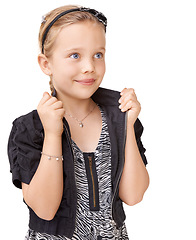 Image showing Fashion, stylish and girl in trendy clothes for a photo shoot isolated on a white background in studio. Fashionable, style and child model in edgy modern clothing with a smile on a studio background