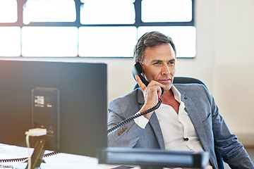 Image showing Telephone, office and man on a business call for a corporate company deal, sale or partnership. Phone call, professional and mature male ceo, boss or entrepreneur having a conversation in workplace.