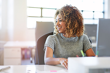 Image showing Thinking, working and motivation with a business black woman sitting her desk in the company office. Idea, inspiration and vision with a young female employee at work on a target or goal