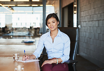 Image showing Business woman, portrait smile and writing for planning, strategy or signing contract of employment at office desk. Young female employee working on paperwork for corporate plan or idea at workplace