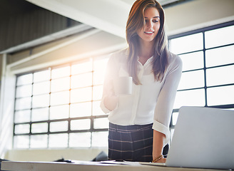 Image showing Laptop, coffee and business woman in office reading email in workplace. Tea, computer and happy female employee holding espresso while working, looking at report or advertising proposal in company.