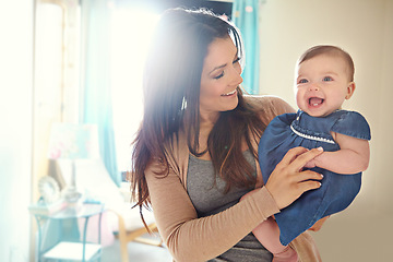 Image showing Mother, bonding or laughing baby girl in house living room or family home bedroom in support trust, security or love carrying. Smile, infant or happy mom holding child in funny or comic tickling game