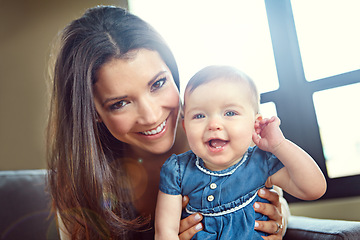 Image showing Mom, bonding and baby girl portrait in house living room or family home sofa in support trust, security and love hug. Smile, infant and happy mother holding child for social media and profile picture