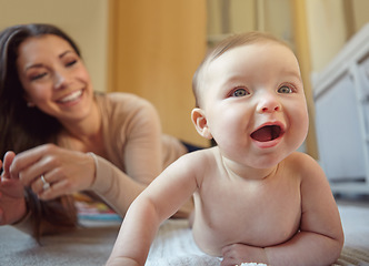 Image showing Happy, mother and baby playing in their home together with fun, love and playful bonding. Happiness, smile and young mom spending time with her infant girl child in their house for child development.