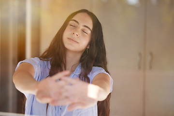 Image showing Wake up, stretching and morning with a woman in a bedroom, sitting after sleeping or rest at home. Peace, relax and stretch with a female waking up in her bed feeling fresh on the weekend or time off