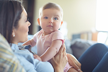 Image showing Woman, bonding and mother with baby girl on house living room, nursery or family home sofa in trust, support or love. Curious, infant and child with mom in relax, security or safety comfort on couch