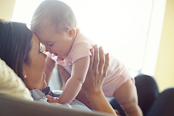 Image showing Mom, bonding or forehead touch with baby girl on house living room, relax nursery or family home sofa in trust or love. Smile, happy or infant child playing mother in support, security or relax game