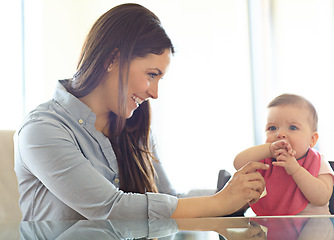 Image showing Mother, baby child and chair for play, bonding and love at table with smile, morning and happiness. Mom, infant kid and happy together in family home for development, help or care in living room