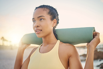 Image showing Face, fitness and woman with yoga mat at beach preparing for workout, training or exercise. Zen chakra, meditation and female yogi thinking about pilates for health, wellness and mobility at sunset.