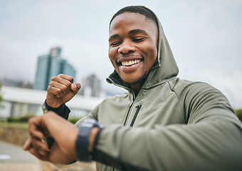 Image showing Fitness, goal and black man reading watch for training progress, running celebration and exercise success in Nigeria. Monitor, celebrate and runner happy with cardio performance on smart watch