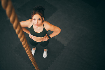 Image showing Rope climbing, gym and fitness woman with focus for sports challenge, full body workout and healthy training. Female athlete, climb exercise and top view with power, strong mindset and motivation