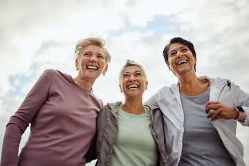 Image showing Diversity, happy women and laughing for sports, fitness and support on mockup sky background. Low angle, senior female group and exercise friends excited for community wellness, freedom or motivation