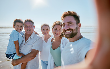 Image showing Family, beach and selfie while on vacation in summer with child, parents and grandparent together for travel update while a smile, love and care. Portrait of men, women and kid at sea for a holiday