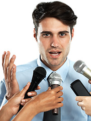 Image showing Reporter microphone, portrait and interview for businessman, government worker or speaker. Speech, communication and hands of news journalist asking question to politician on white background studio