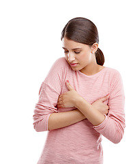 Image showing Gender dysmorphia, woman and anxiety of a model holding breast feeling stress. White background, vulnerable and isolated person with worry for breast cancer awareness or health care in a studio