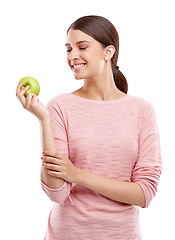 Image showing Health, food and smile with apple with woman for nutrition, diet and weight loss choice. Fiber, care and vitamins with isolated face of girl eating fruit for wellness, organic and natural in studio