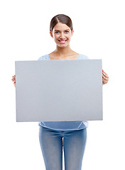 Image showing Woman, happy portrait and blank board standing in white background for advertising, marketing and branding vision. Model, smile and holding empty poster, billboard or banner mockup isolated in studio