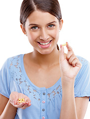 Image showing Portrait, tabket and medicine with a model woman in studio isolated on a white background for vitamins or supplements. Medical, health and pills with a young female on blank space for medication