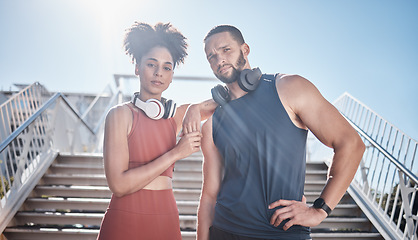 Image showing Black couple, stairs portrait and fitness with headphones for music, motivation and outdoor urban workout. Exercise team, couple and support for health, wellness training and development in summer