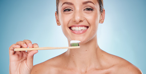 Image showing Brushing teeth, dental and woman with toothbrush for teeth whitening and beauty, oral health and fresh breath with studio background. Mouth wellness, Invisalign portrait and clean with bamboo brush.