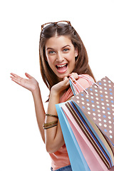 Image showing Woman is shopping, paper bag and retail portrait, fashion with happy customer isolated on white background. Discount, sale and excited customer with shopping bag, luxury designer brand and clothes