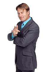 Image showing Businessman, smile and pointing in studio portrait with suit, focus or success in leadership by white background. Happy corporate leader, vision or isolated for executive goal, mission and motivation