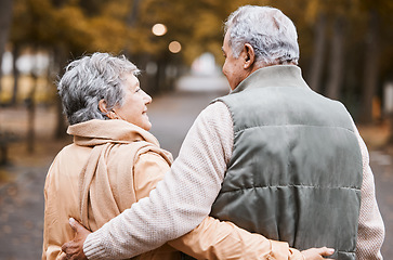 Image showing Senior couple, love and health while walking outdoor for exercise, happiness and care at a park in nature for wellness. Old man and woman together in a healthy marriage during retirement with freedom