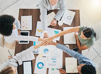 Image showing Business people, hands and top view success of team celebration, motivation and support in meeting, trust or collaboration. Diversity workers, hands together and startup goals, vision and partnership