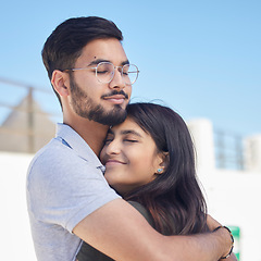 Image showing Love, beach and happy couple hug, relax and enjoy outdoor quality time together for peace, freedom and romantic date. Happiness, sky and man and woman bond on travel holiday in Rio de Janeiro Brazil