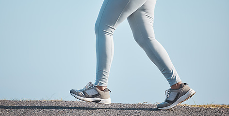 Image showing Fitness, nature and legs of a woman running for health, wellness and endurance training in the street. Sports, workout and female athlete doing a cardio exercise for a race, marathon or competition.