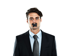 Image showing Secret, silence and portrait of a businessman with tape on lips isolated on a white background. Quiet, hostage and silenced employee with covered mouth as an office worker on a studio background