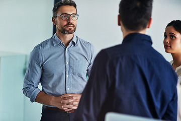 Image showing Business people, team and meeting in discussion for idea, strategy or marketing plan at the office. Group of employee workers in business meeting, conversation or collaboration at the workplace