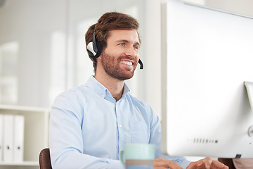 Image showing Call center, computer and businessman with smile for virtual support, communication and software help in information technology office. Happy corporate worker with technology for telemarketing sales