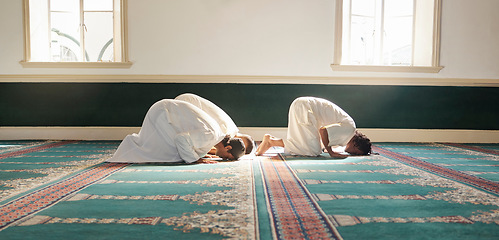 Image showing Muslim, prayer and mosque with a spiritual man group praying together during fajr, dhuhr or asr, otherwise maghrib or ishaa. Salah, worship and pray with islamic friends observing ramadan tradition