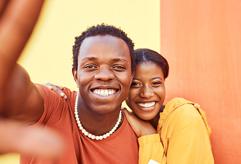 Image showing Selfie, love and memories with a black couple posing for a photograph together on a color wall background. Portrait, happy and smile with a man and woman taking a picture while bonding outside