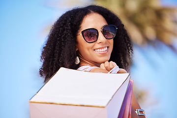 Image showing Freedom, summer and girl with shopping bag portrait and smile in sunny Los Angeles, USA. Happy, consumerism and trendy black woman fashionista girl with retail bags for stylish lifestyle.