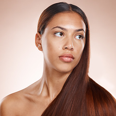 Image showing Hair care, shine and woman thinking of shampoo, hairdresser glow and results from a hair salon on a studio background. Keratin, long hair and face of a model marketing an idea for natural hair health