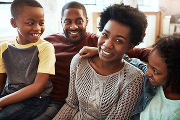 Image showing Black family, smile and relax on living room sofa for happy bonding or quality time together at home. African American mother, father and children relaxing and smiling for family holiday on the couch