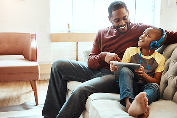 Image showing Digital tablet, father and boy on a sofa watching a funny, comic or meme video on social media. Happy, smile and African man streaming a movie with his child on mobile device while relaxing together.