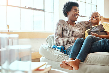 Image showing Family, mother and son relax on a sofa, laughing and happy while bonding in a home together. Mom, love and boy resting with his parent, content and playful while sitting and talking in a living room