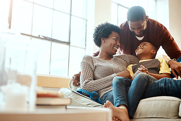 Image showing Black family, happy and relax on sofa with boy and parents, hug and laughing in their home together. Happy family, mother and father playing with their son on a couch, content and joy in living room