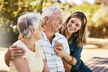 Image showing Family, senior parents and woman holding with care, love and hug bonding outdoor in a park. Smile, happy person and people in retirement with adult daughter together with bokeh in nature in summer