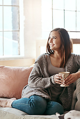 Image showing Relax, coffee and woman on a living room couch feeling calm and peace at home. Tea, happiness and smile of a person in the morning thinking with gratitude of peaceful lounge day in a house smiling