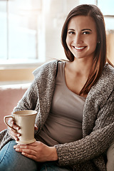 Image showing Smile, woman and coffee portrait at home on a living room sofa feeling calm and relax. House, tea and morning happiness of a person with a drink on a house lounge couch peaceful and smiling alone