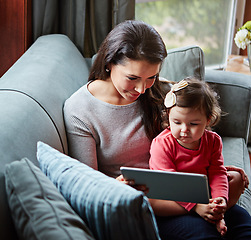 Image showing Mother, baby and tablet for video call on sofa in living room for online communication or mobile virtual chat in family home. Mom smile, child and streaming web call on digital tech device on couch